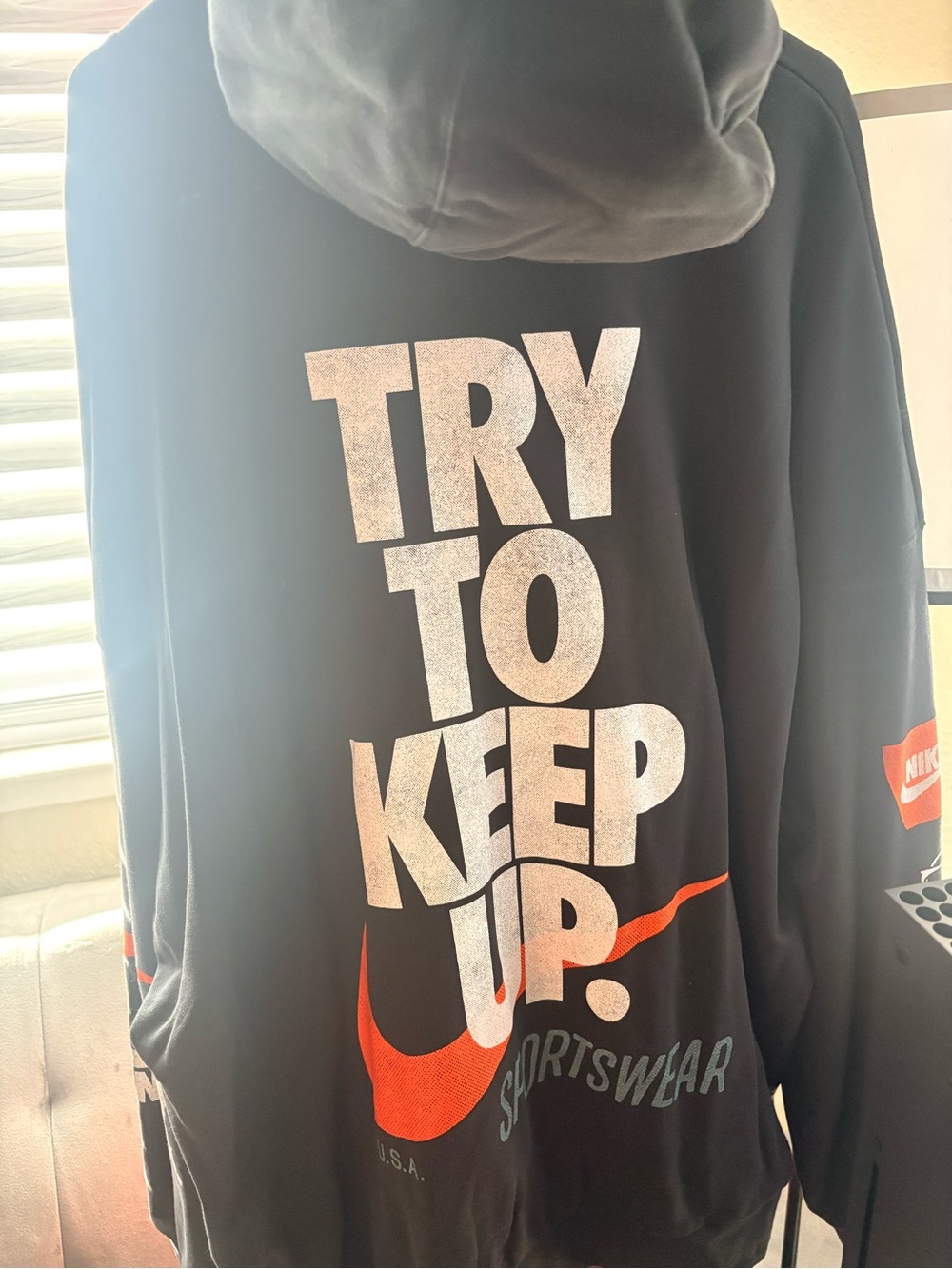 Nike Black Hoodie with White 'TRY TO KEEP UP' Graphic and Orange Swoosh